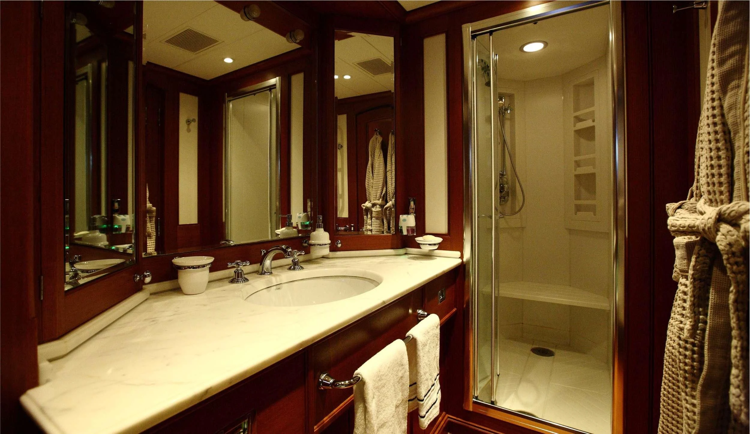 a bathroom with a large mirror aboard HERITAGE M Yacht for Charter