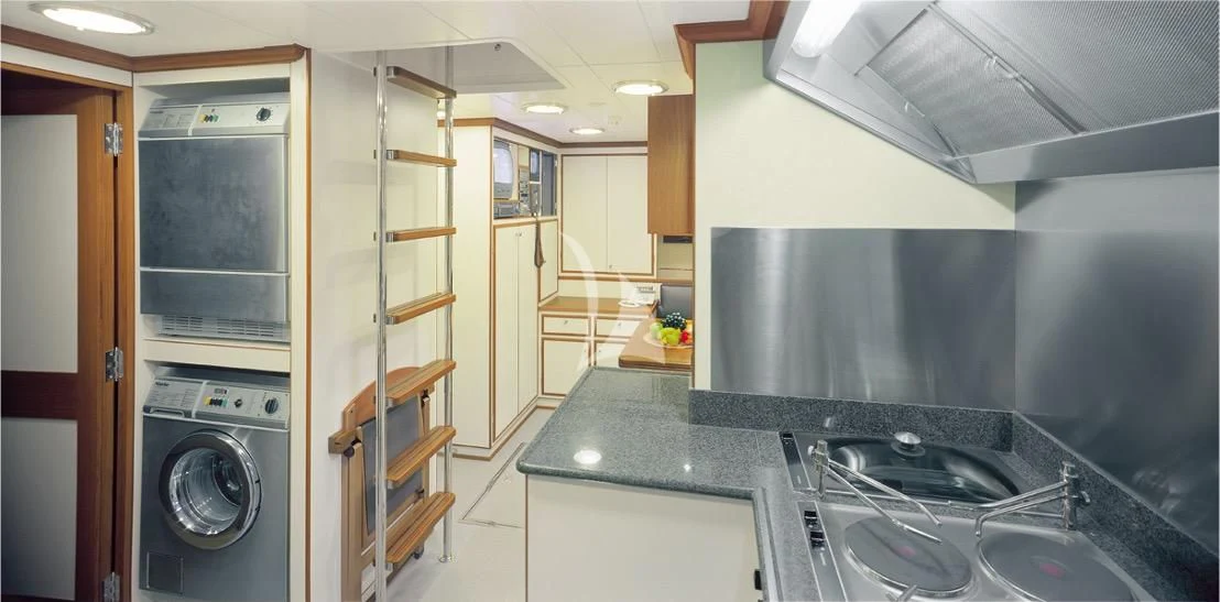 a kitchen with a large stainless steel oven and a steel stove aboard HERITAGE M Yacht for Charter
