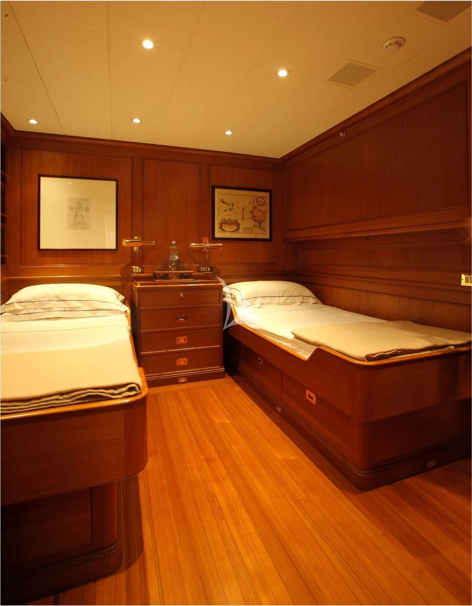 a room with a bed and a desk aboard HERITAGE M Yacht for Charter