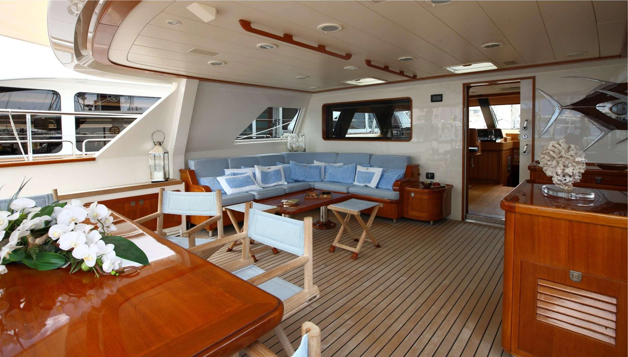 a room with a couch and a television aboard HERITAGE M Yacht for Charter