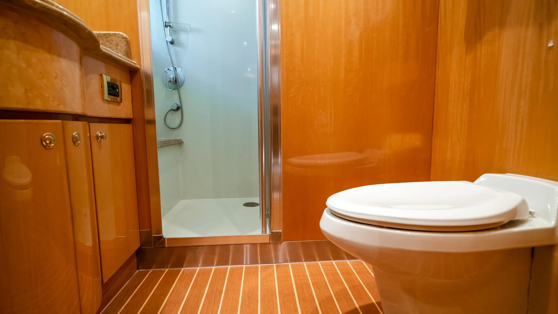 a bathroom with a glass shower aboard VITESSE Yacht for Sale