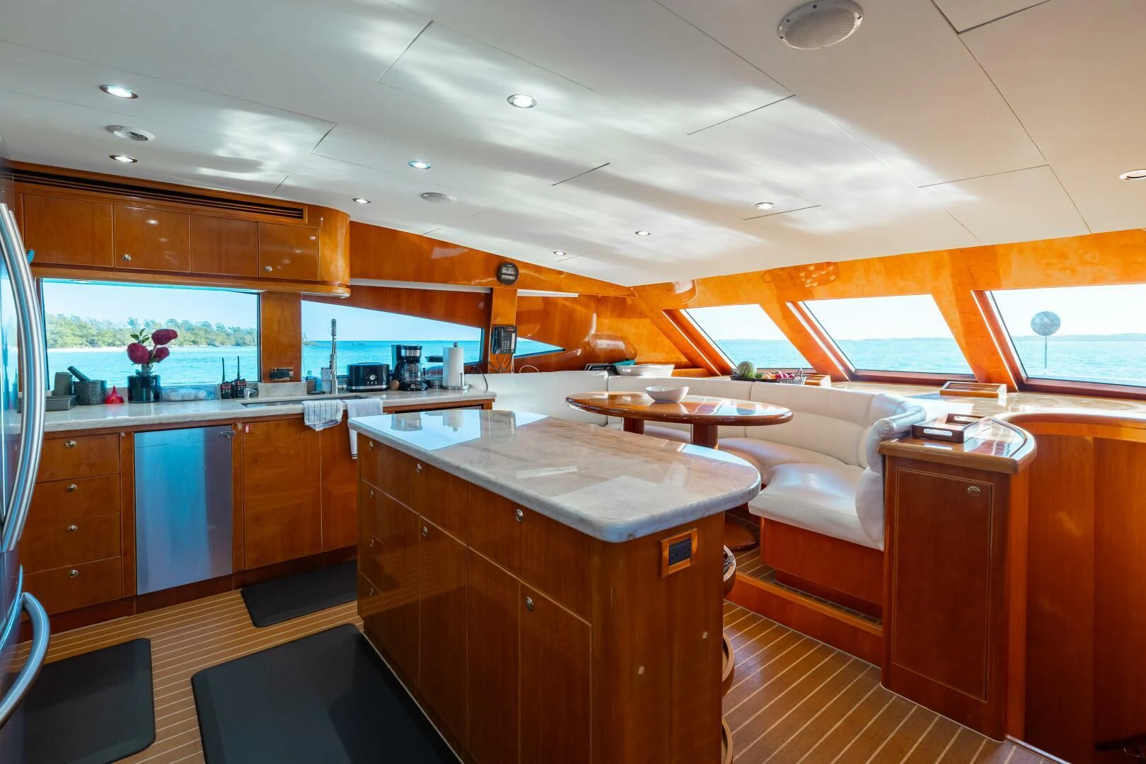 a kitchen with a bar and a table aboard VITESSE Yacht for Sale