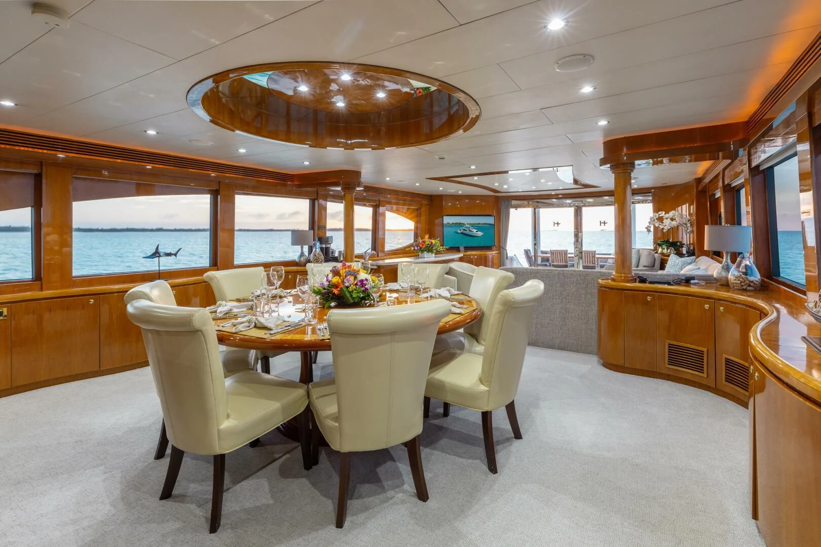 a large room with a table and chairs aboard VITESSE Yacht for Sale