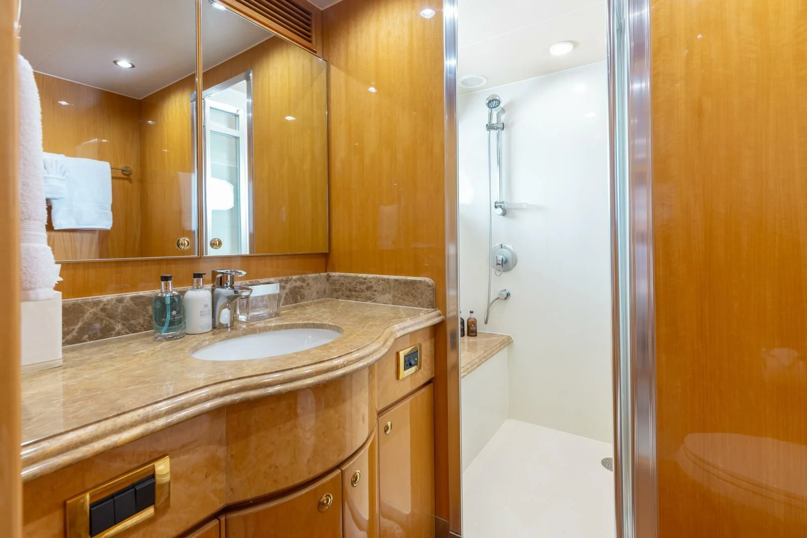 a bathroom with a countertop sink and a shower aboard VITESSE Yacht for Sale