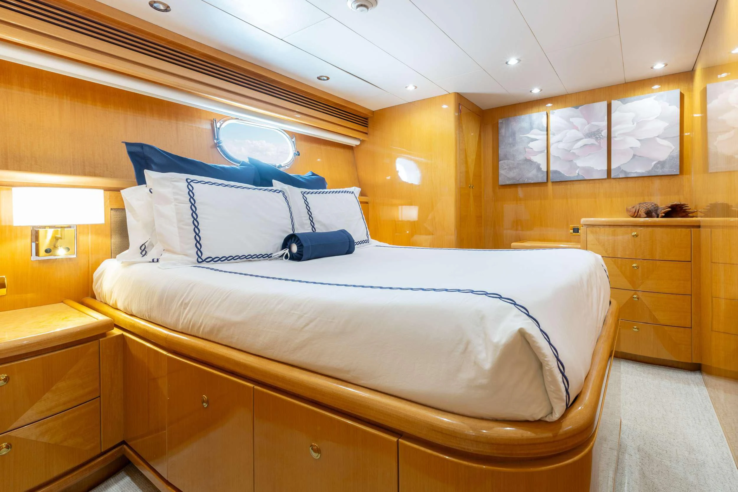 a bed with white sheets aboard VITESSE Yacht for Sale