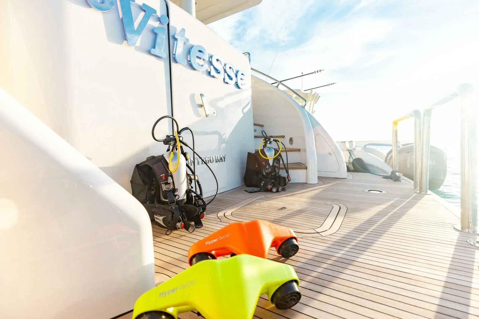 a yellow car on a track aboard VITESSE Yacht for Sale
