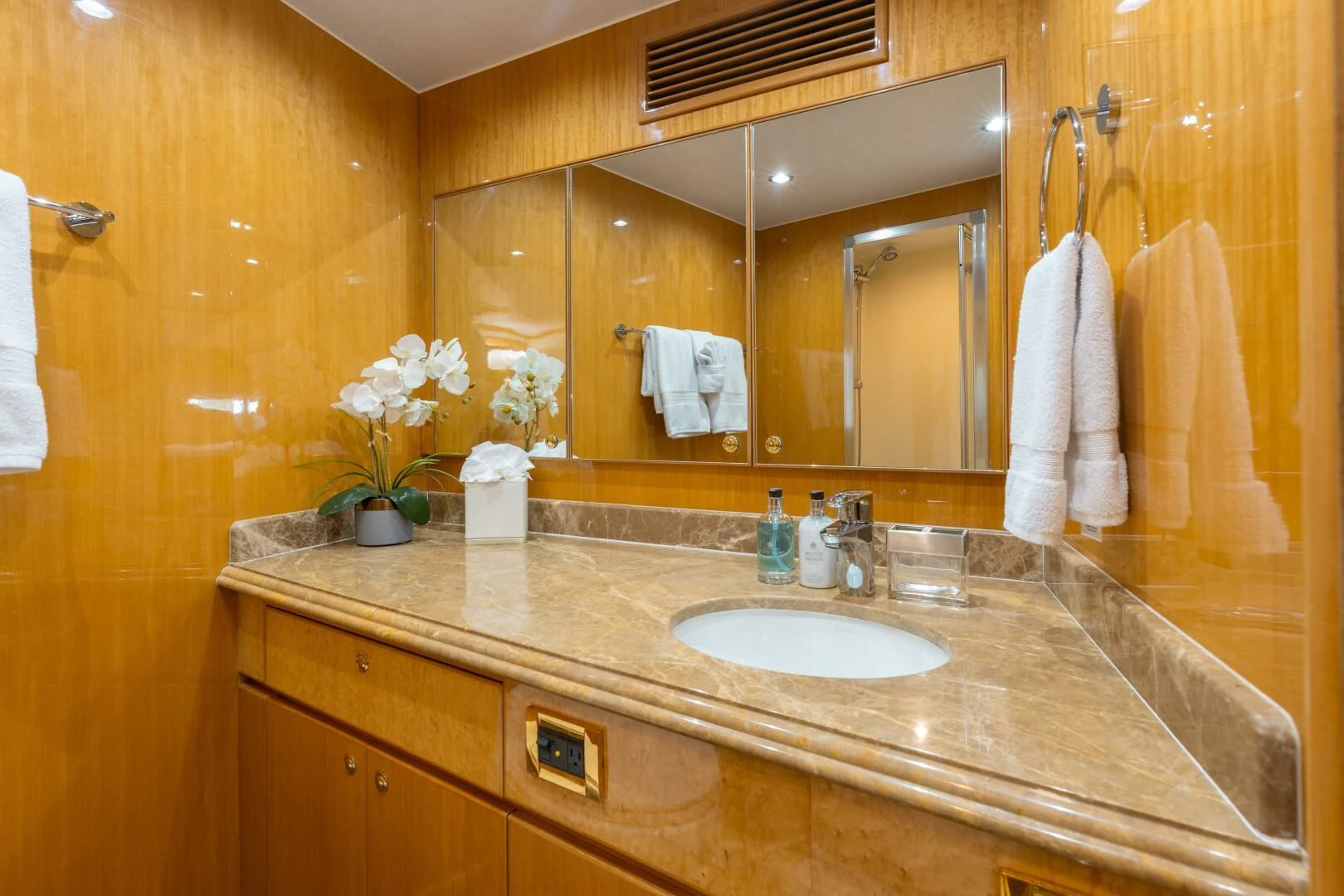 a bathroom with a large mirror aboard VITESSE Yacht for Sale