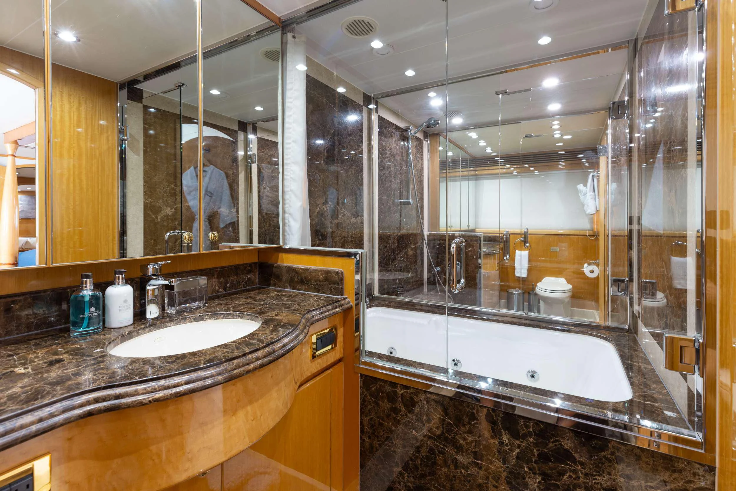 a bathroom with a large mirror aboard VITESSE Yacht for Sale