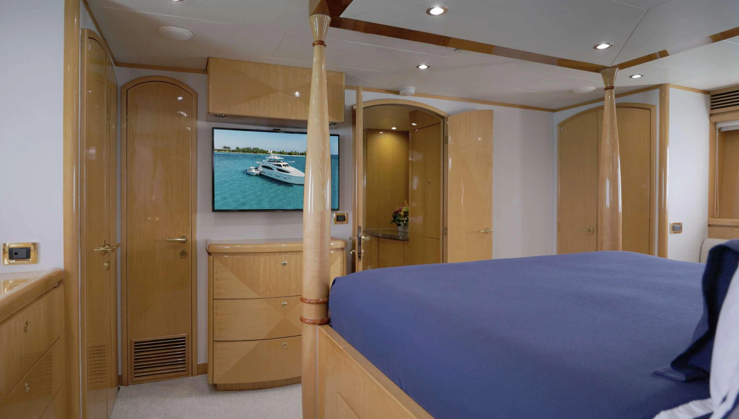 a bedroom with a bed and a television aboard VITESSE Yacht for Sale