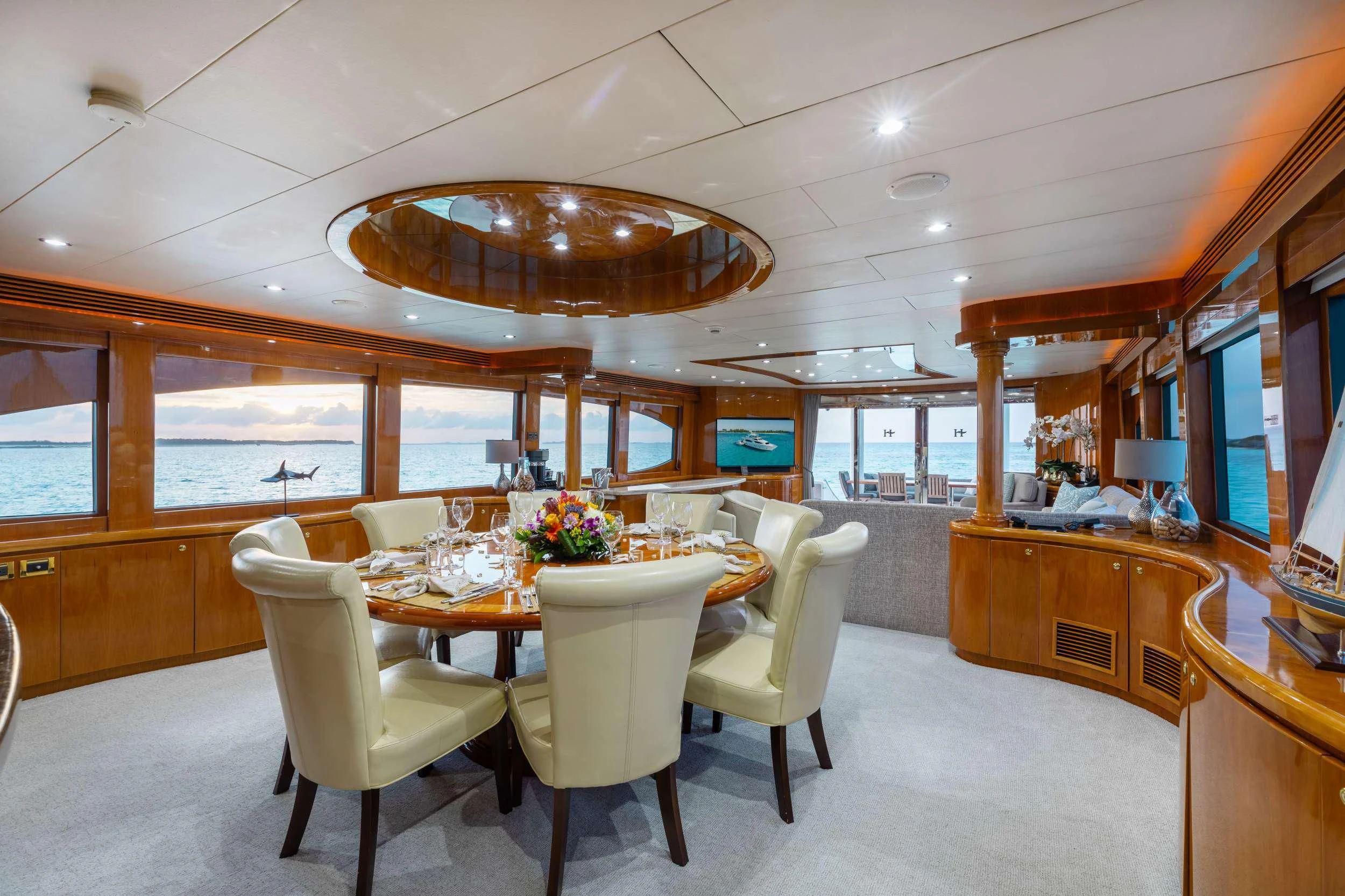a large room with tables and chairs aboard VITESSE Yacht for Sale