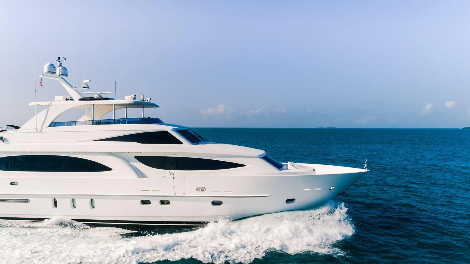 a white yacht on the water aboard VITESSE Yacht for Sale