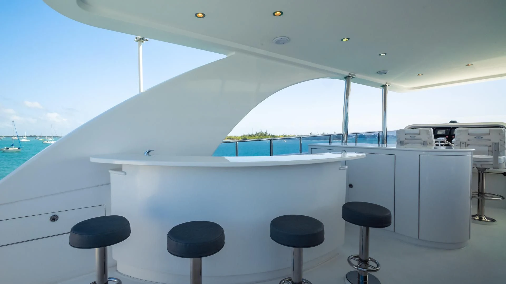 a white room with a desk and chairs and a large window aboard VITESSE Yacht for Sale