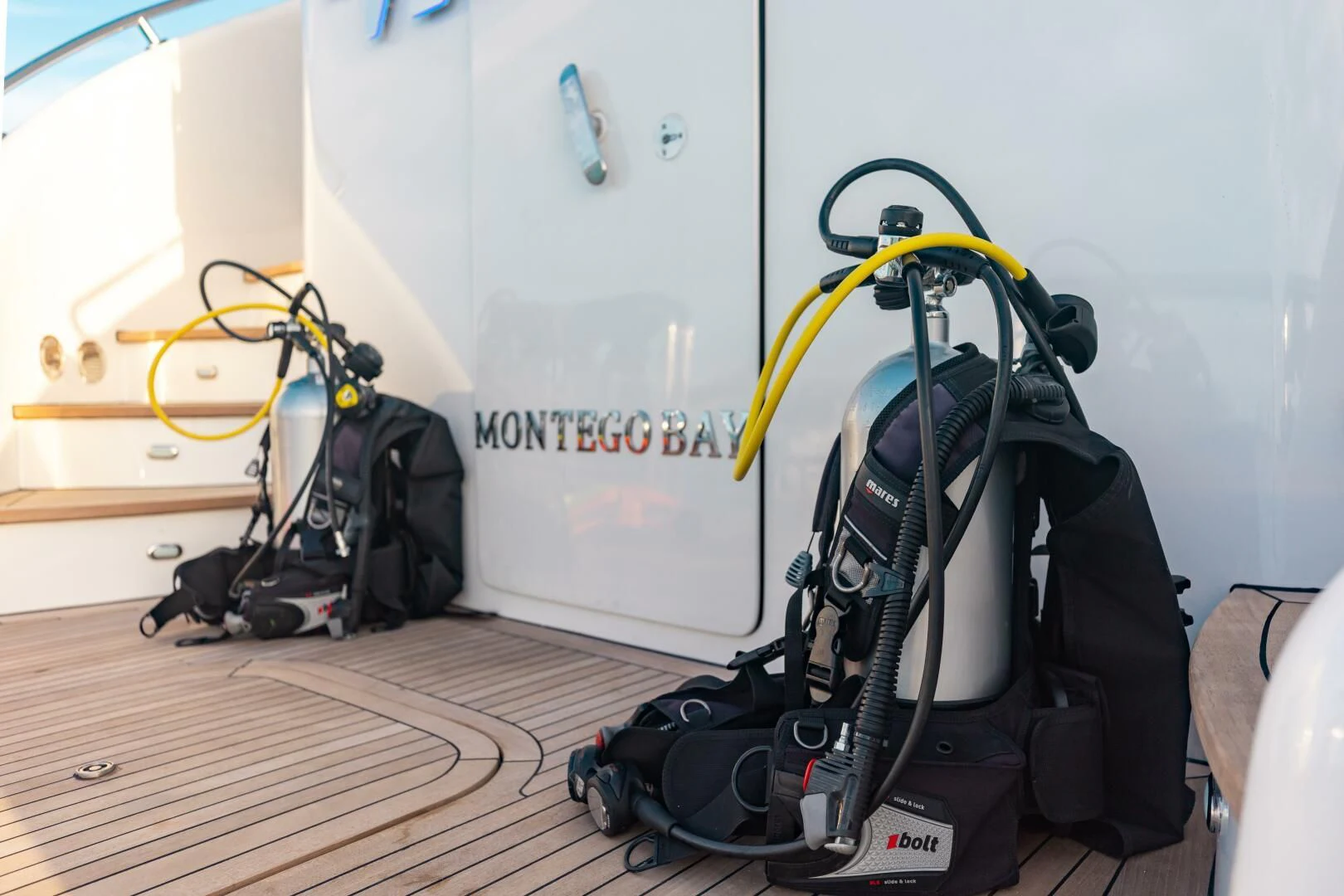 a group of luggage on a wooden floor aboard VITESSE Yacht for Sale