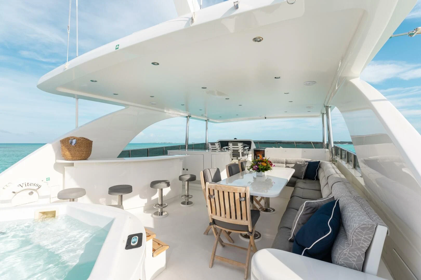 a room with a table chairs and a couch aboard VITESSE Yacht for Sale