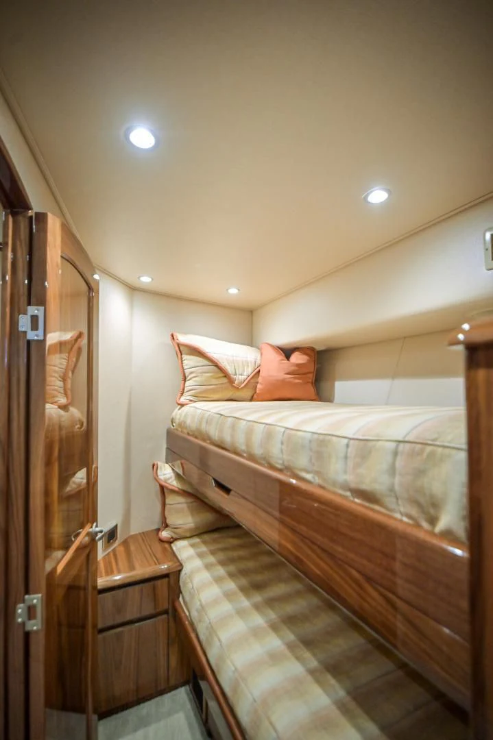 a bedroom with a bed and a door aboard GALATI  TRADE Yacht for Sale