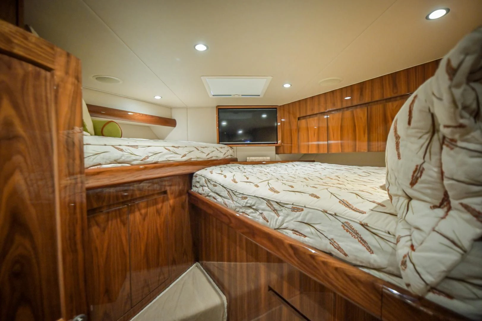 a room with a bed and a television aboard GALATI  TRADE Yacht for Sale