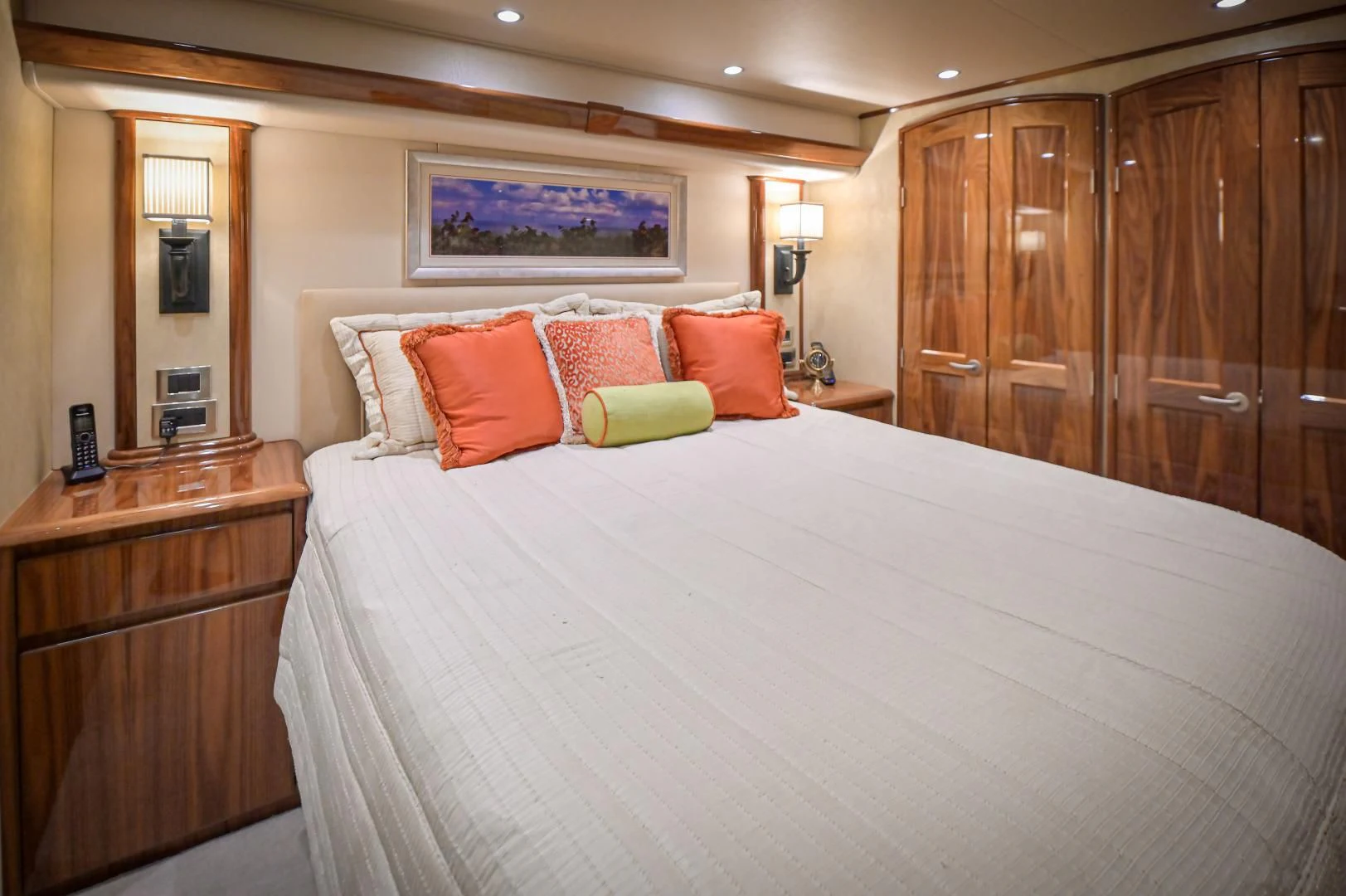 a bed with colorful pillows aboard GALATI  TRADE Yacht for Sale