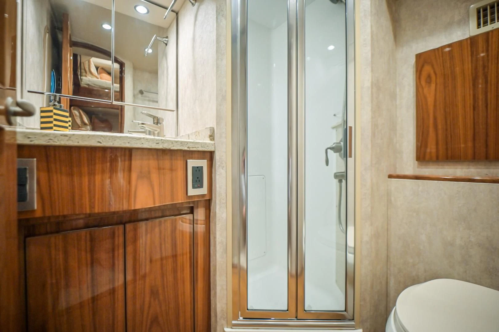 a bathroom with a glass shower aboard GALATI  TRADE Yacht for Sale