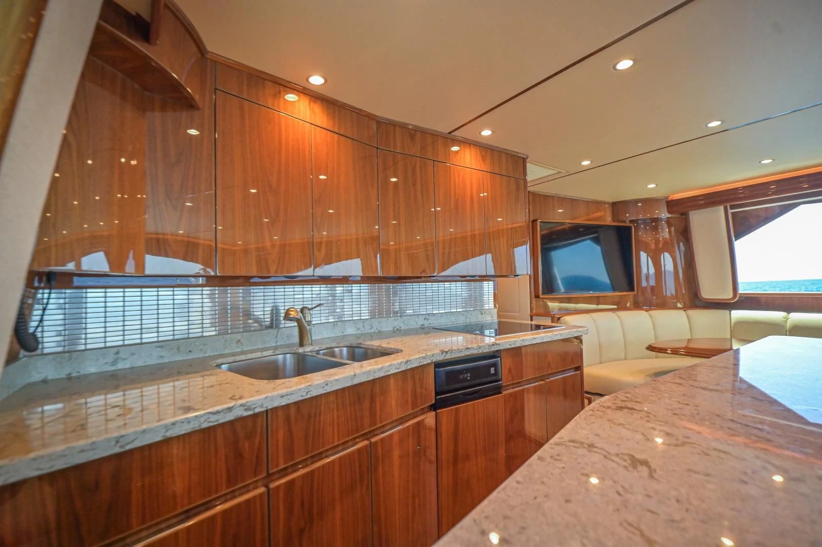 a kitchen with wooden cabinets aboard GALATI  TRADE Yacht for Sale