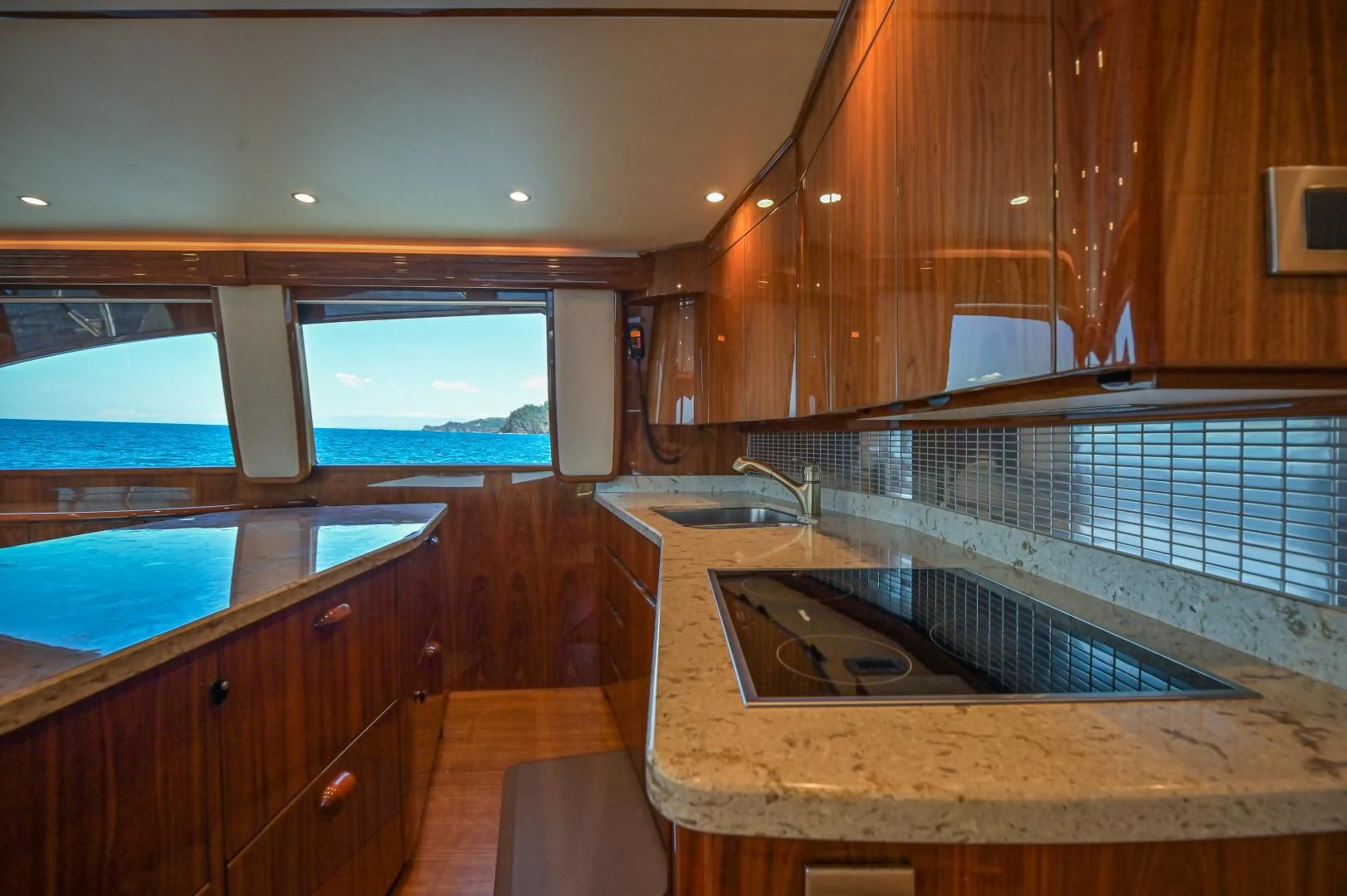 a kitchen with a sink and a large window aboard GALATI  TRADE Yacht for Sale