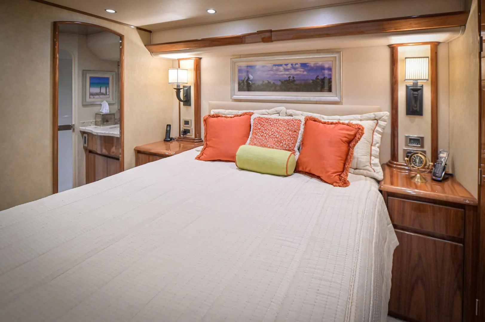 a bed with pillows and a mirror aboard GALATI  TRADE Yacht for Sale