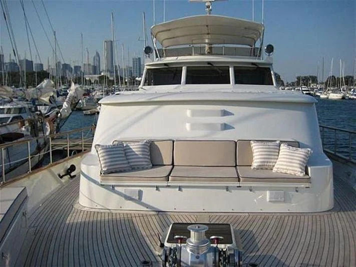 a large white boat in a harbor aboard SALLY JO II Yacht for Sale