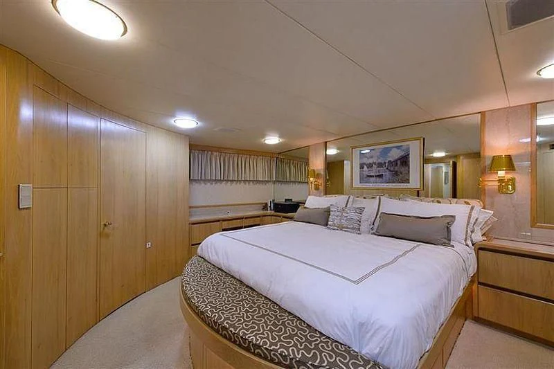 a large bedroom with a large bed aboard SALLY JO II Yacht for Sale