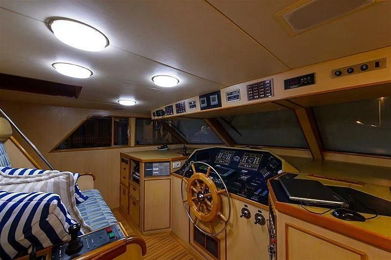 a room with a bed and a desk aboard SALLY JO II Yacht for Sale