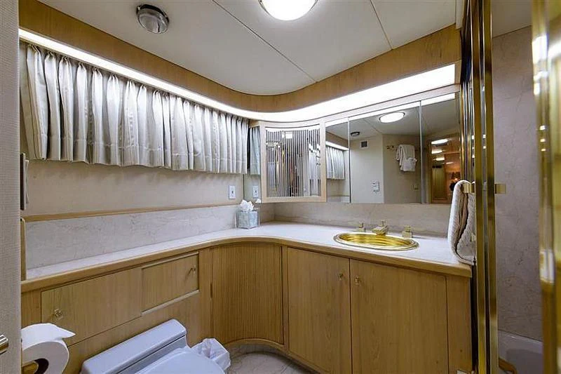 a bathroom with a sink and a mirror aboard SALLY JO II Yacht for Sale
