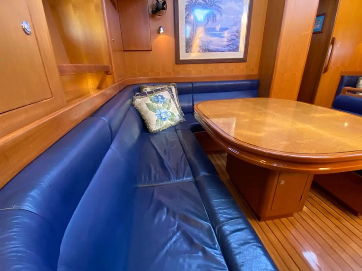 a table with a cushion aboard EL CACIQUE Yacht for Sale