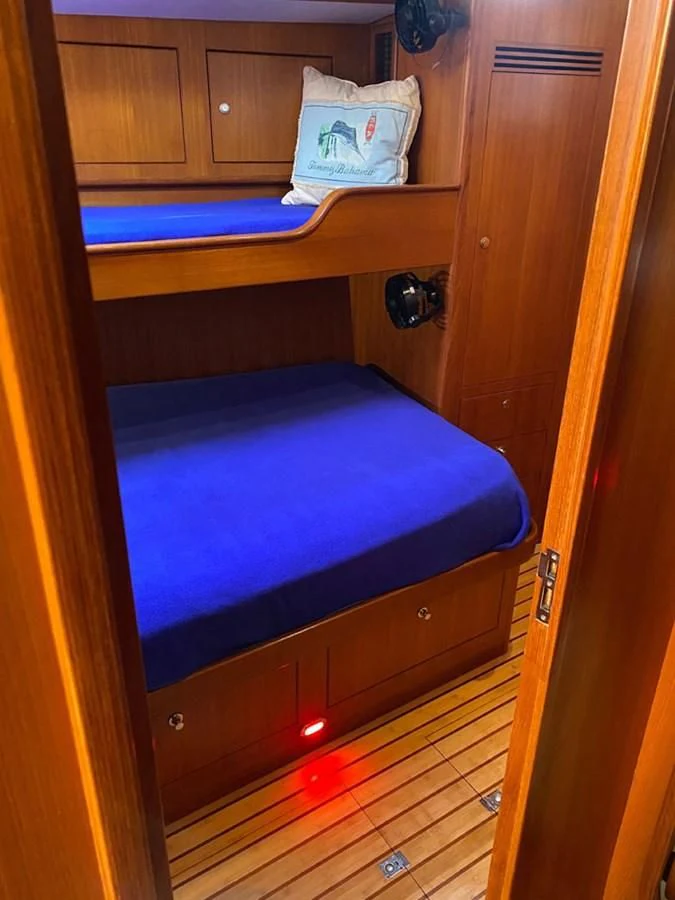 a bed in a room aboard EL CACIQUE Yacht for Sale