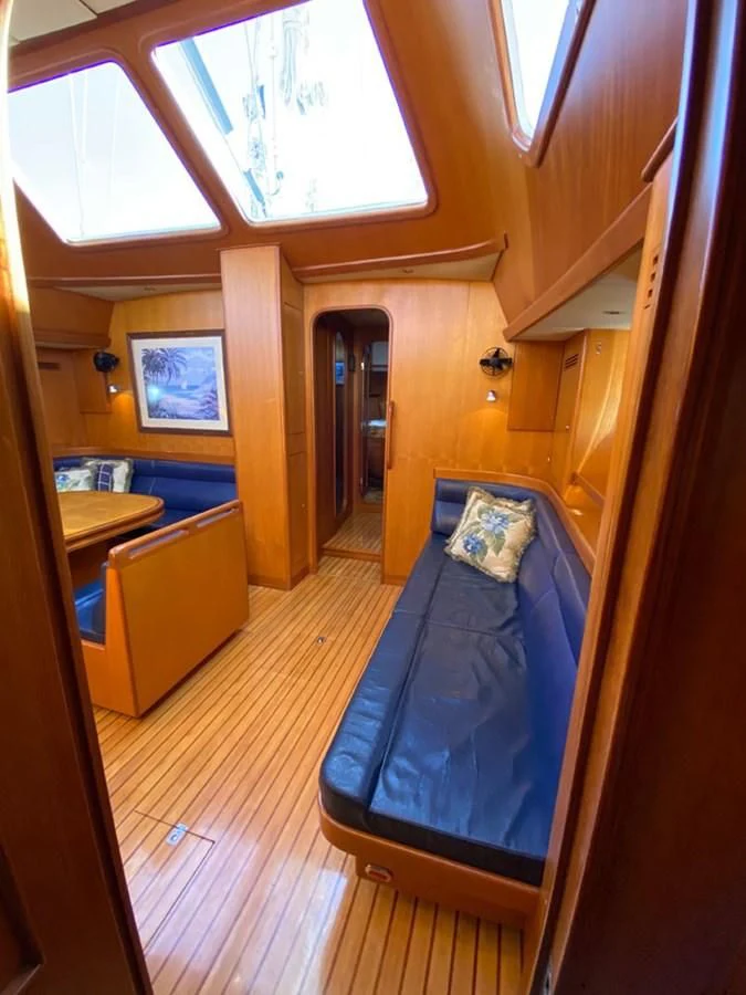 a room with a blue bed aboard EL CACIQUE Yacht for Sale