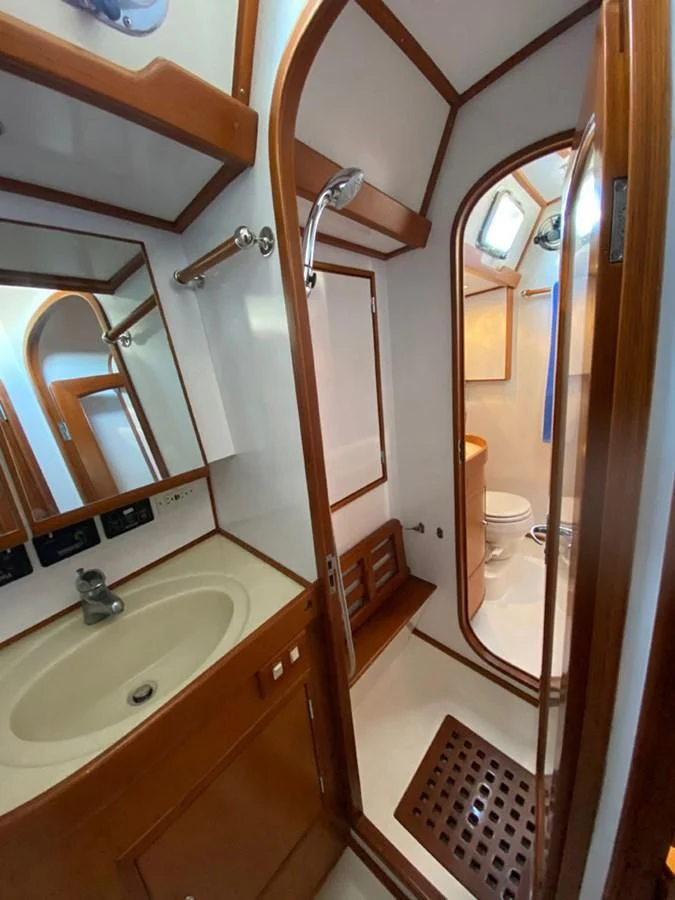 a bathroom with a sink and a toilet aboard EL CACIQUE Yacht for Sale