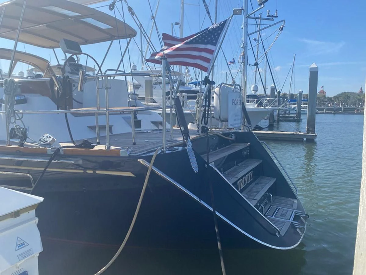 a boat with a flag on it aboard EL CACIQUE Yacht for Sale