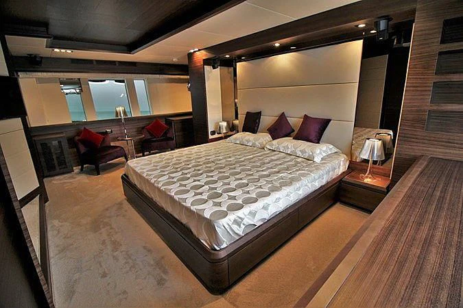 a large bed in a room aboard G Yacht for Sale