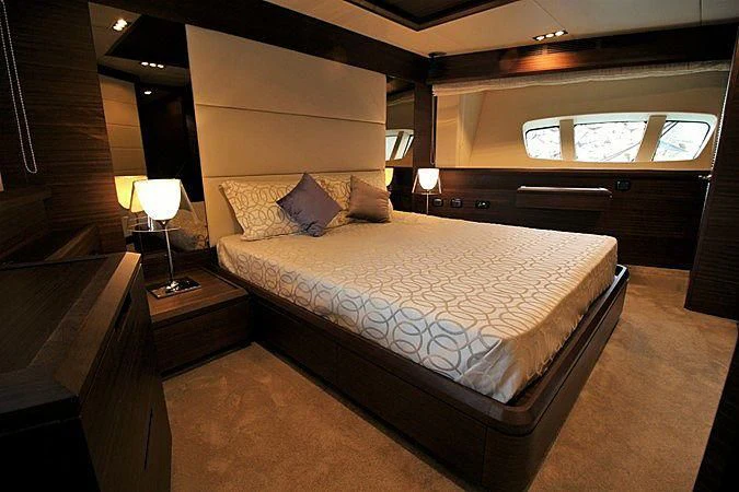 a bed in a room aboard G Yacht for Sale