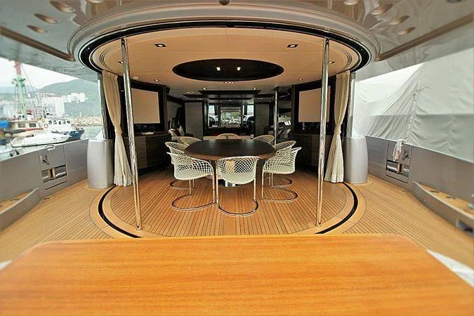 a room with a table and chairs aboard G Yacht for Sale