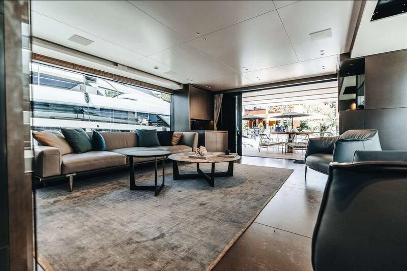 a living room with a large window aboard DRAGONFLY I Yacht for Sale