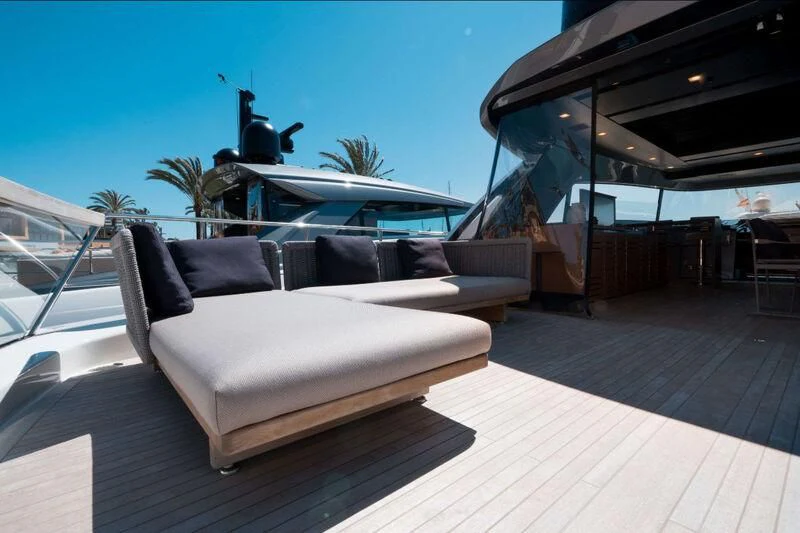 a white couch on a deck aboard DRAGONFLY I Yacht for Sale
