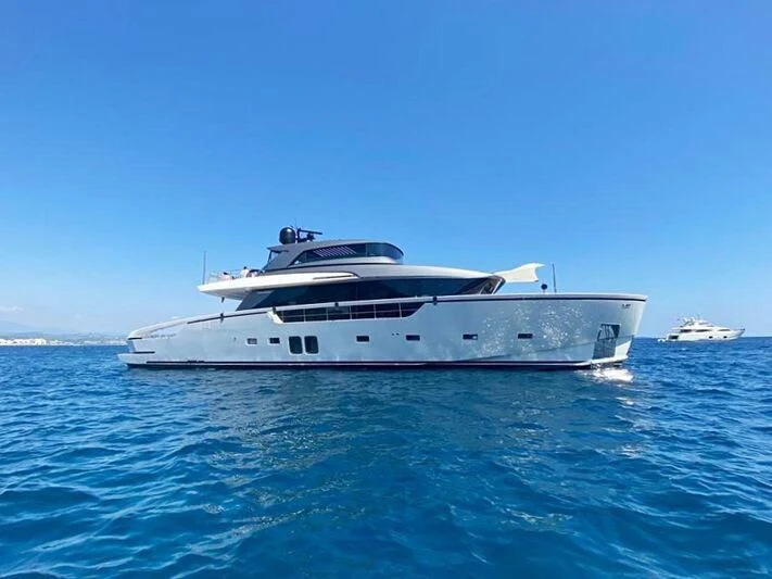 a white yacht in the water aboard DRAGONFLY I Yacht for Sale
