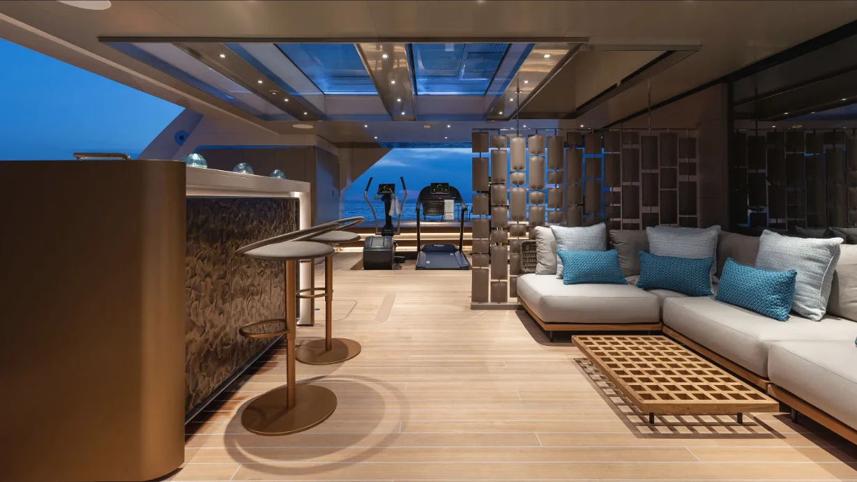 a room with a couch and a table aboard CLOUD 9 Yacht for Sale