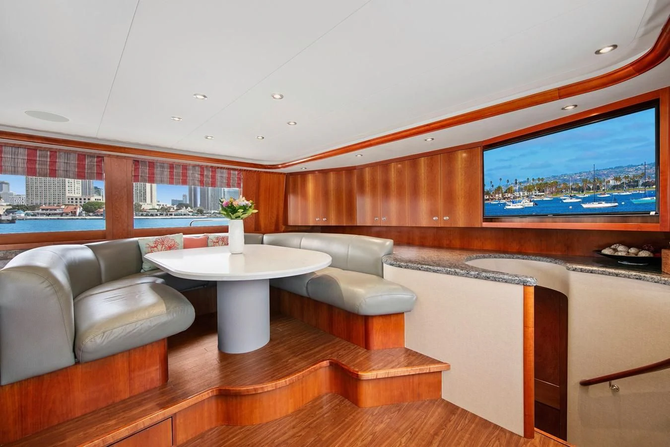 a room with a table and couches aboard DESPERADO Yacht for Sale
