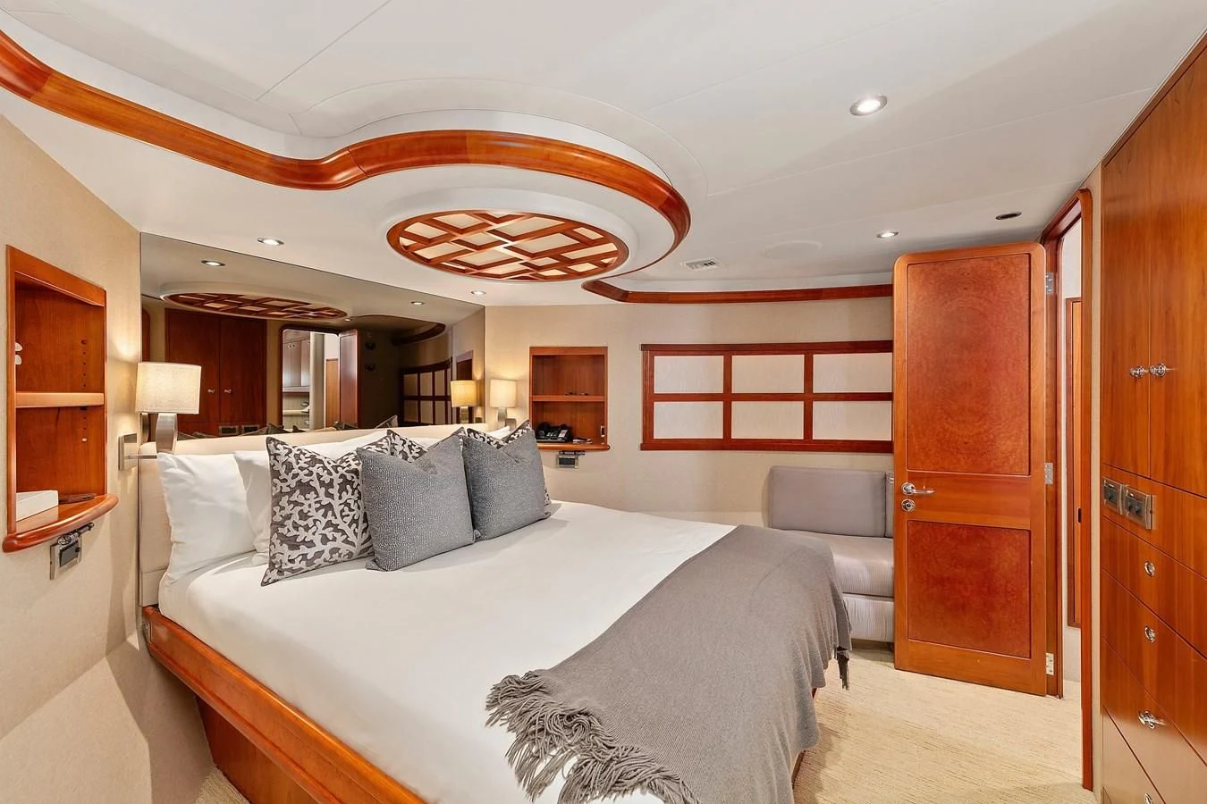 a large bedroom with a bed aboard DESPERADO Yacht for Sale