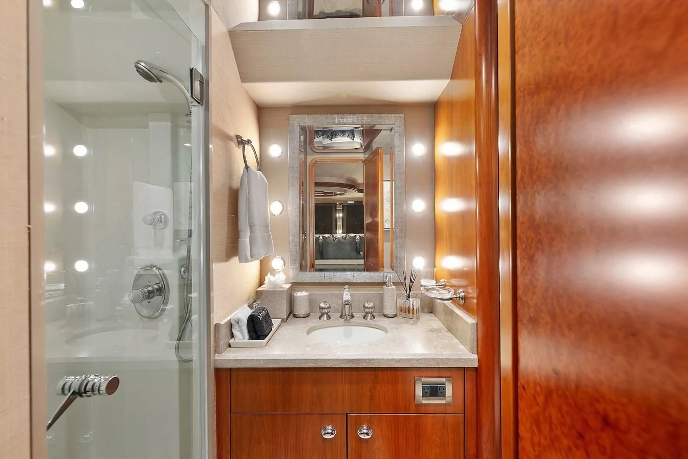 a bathroom with a glass shower door aboard DESPERADO Yacht for Sale