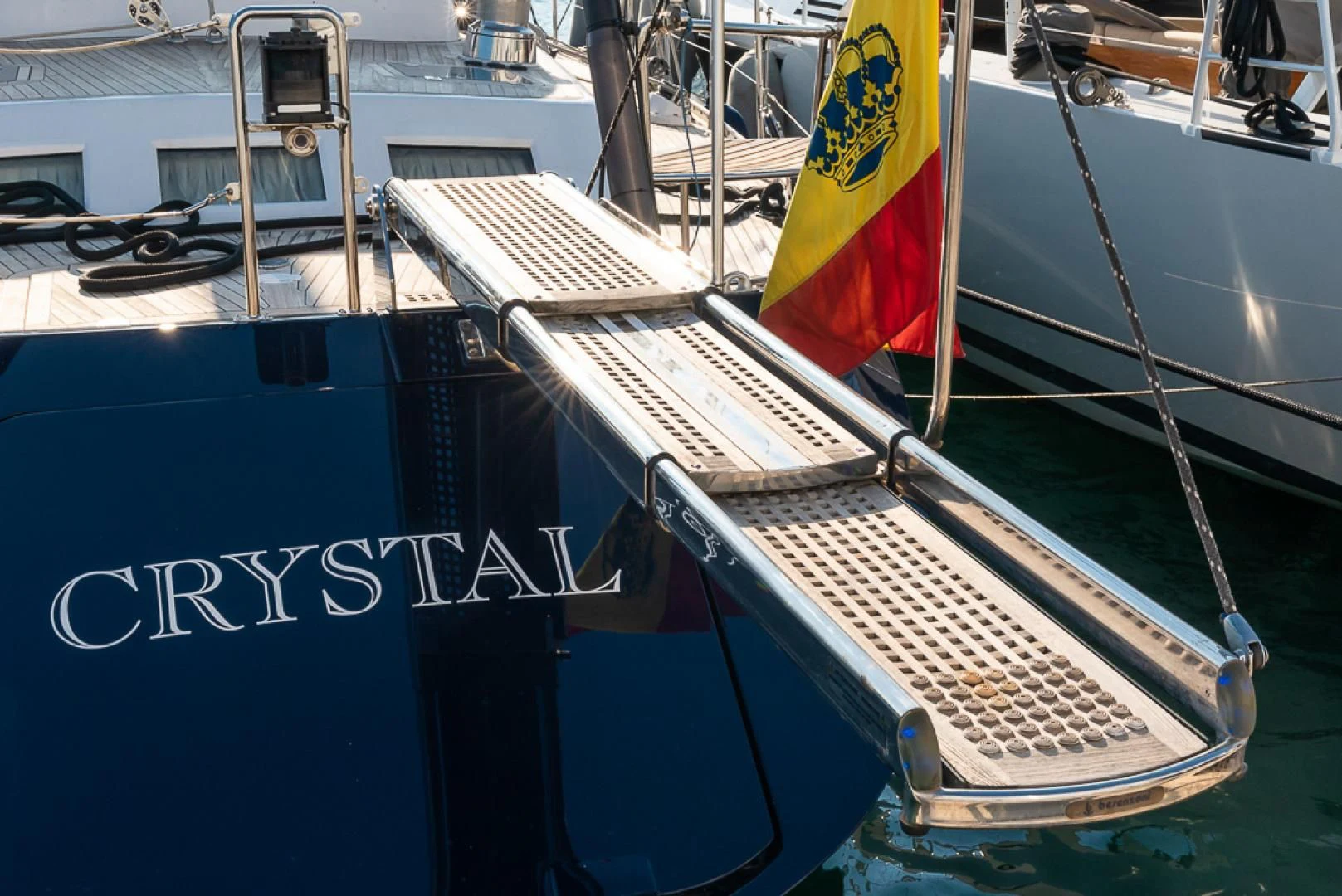a boat with a flag on it aboard CRYSTAL Yacht for Sale