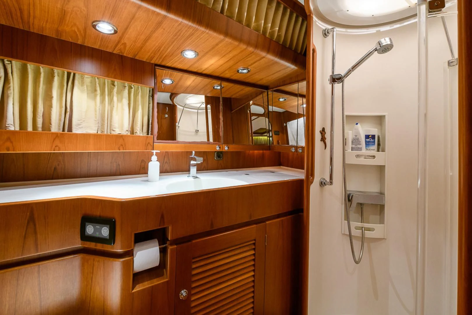 a bathroom with a sink and a shower aboard CRYSTAL Yacht for Sale