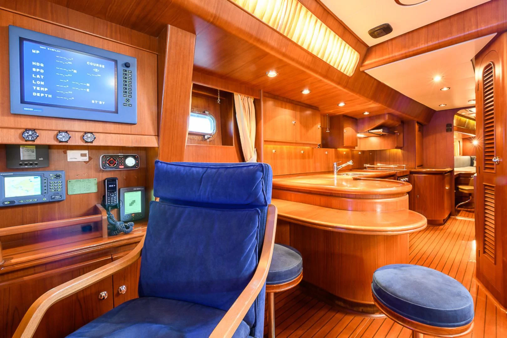 a room with a tv and chairs aboard CRYSTAL Yacht for Sale