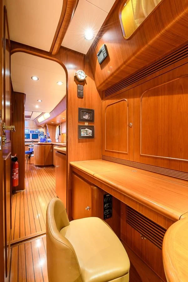 a kitchen with wooden cabinets aboard CRYSTAL Yacht for Sale