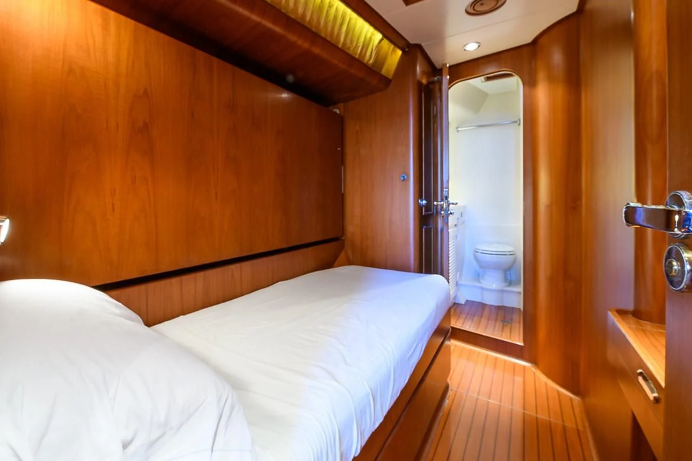 a bed in a room aboard CRYSTAL Yacht for Sale