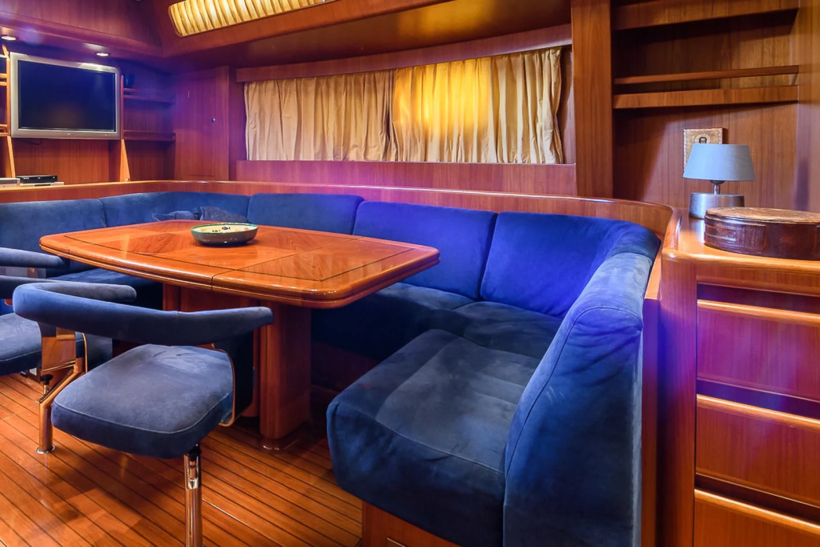 a room with a couch and a table aboard CRYSTAL Yacht for Sale